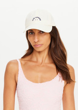THE UPSIDE women's cream 100% cotton Marlon Soft Cap has an adjustable navy paracord tie at back with gold metal eyelets. Made for lifestyle.