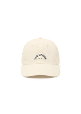 THE UPSIDE women's cream 100% cotton Marlon Soft Cap has an adjustable navy paracord tie at back with gold metal eyelets. Made for lifestyle.