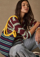 THE UPSIDE women’s stripe organic cotton Cabana Jana Crochet Tote is handmade in a striped navy, mint and burgundy design with yellow detail. Made for lifestyle.