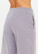 THE UPSIDE women’s sparkle grey Galaxia Marnie Wide Leg Pant is high rise with side pockets, an elasticated waistband and a maroon drawcord. Made for lifestyle.
