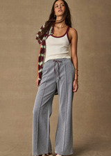 THE UPSIDE women’s sparkle grey Galaxia Marnie Wide Leg Pant is high rise with side pockets, an elasticated waistband and a maroon drawcord. Made for lifestyle.