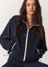 THE UPSIDE women’s navy recyled Sol Fleece Jacket offers a relaxed fit and features a zip through front, front zip pockets, elasticated waist and cuffs and contrast paracord zip pullers. Made for lifestyle.
