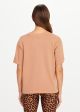 THE UPSIDE women’s brown 100% organic cotton Jacob Tee is designed for an oversized fit and features a ribbed collar and printed logo detail. Made for lifestyle.