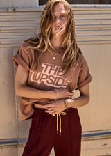 THE UPSIDE women’s brown 100% organic cotton Jacob Tee is designed for an oversized fit and features a ribbed collar and printed logo detail. Made for lifestyle.