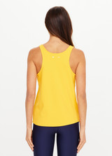 THE UPSIDE women’s yellow recycled mesh Issy Tank Top is a regular fit racerback tank and features a scoop neckline and longline silhouette. Made for performance.