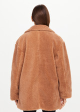 THE UPSIDE women’s brown recycled polyester Gracie Teddy Coat is a relaxed fit mid length coat and features a double breasted closure, welt pockets and faux shearling fabrication. Made for lifestyle.