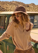 THE UPSIDE women’s sand linen organic cotton Bonita V Neck Knit is designed for a regular fit and features a wide neckline, dropped shoulders and ribbed trims. Made for lifestyle.