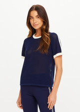 THE UPSIDE women’s navy 100% organic cotton Fenway Jordan Knit Tee offers a relaxed fit and features an open knit construction, contrast sleeve stripe detailing and ribbed trims. Made for lifestyle.