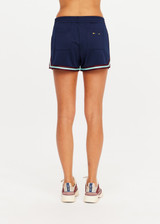 THE UPSIDE women’s navy recycled polyester Cleopatra Short features a mid rise elasticated waistband, curved hem with side splits, back pockets and contrast stripe tape detail. Made for lifestyle.