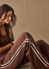 THE UPSIDE women's brown Marnie Silk Wide Leg Pant is true to size with high-rise fit, elasticated waistband, and cream side seam bindings. Made for lifestyle.