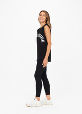 THE UPSIDE women's black Muscle Tank is made of organic cotton jersey. It features low-cut arm openings, rolled bind detail at the sleeve and a white horsehoe logo at the centre front.