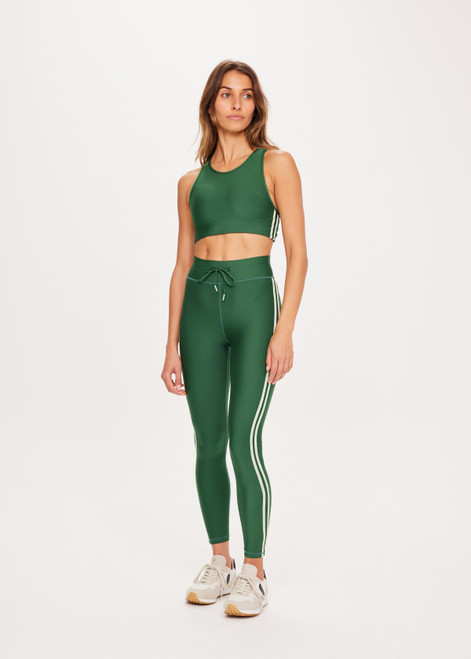 THE UPSIDE Oxford 25inch Midi Pant in Fern Green is a sustainable mid-rise 25” length legging with contrast binds at sides and drawcord waistband.