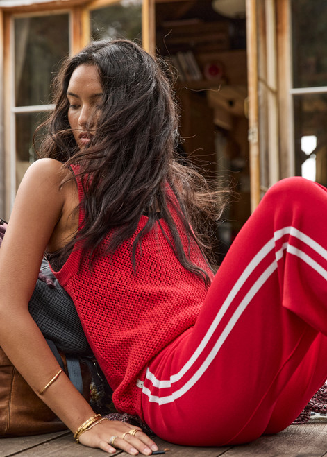 THE UPSIDE women's red Fenway Wales Knit Tank is made from organic cotton. The relaxed fit tank top features open knit and ribbed neckline. Designed for lifestyle wear.