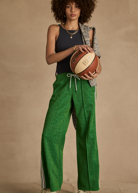 THE UPSIDE women's green Galaxia Loretta Pant is designed for a mid to low rise straight leg fit and features elasticated waistband, drawcord and side seam pockets. Made for lifestyle.