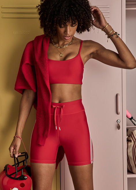 THE UPSIDE women's red eco tech Oxford 5-inch Spin Short is supportive and comfortable with mid-rise, cream side stripes, and elastic waist drawcord. Made for high impact.