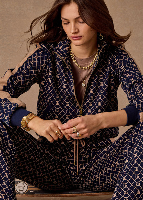 THE UPSIDE women's monogram jacquard Ezra Morgan Quarter Zip features elasticated cuffs, drawcord hem, and front pockets. Made for lifestyle.