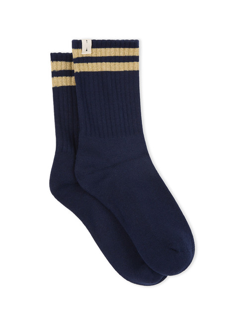 THE UPSIDE women’s navy Curio Crew Sock with jaquard stripes in gold metallic yarn.