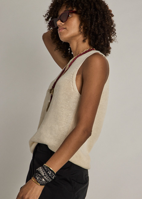 THE UPSIDE women's natural Knitted Tara Tank is made with lightweight linen yarn designed for a relaxed fit. This sleeveless leisure tank features an embroidered horseshoe front logo.