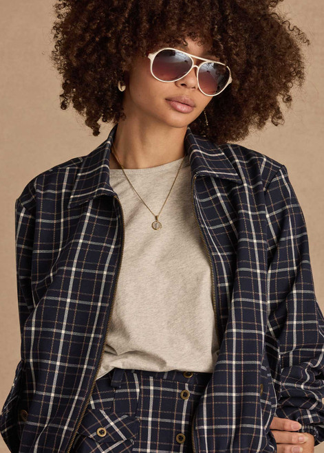 THE UPSIDE women's check Valencia Lexi Collared Jacket is relaxed fit with zip-through bomber style, collar, and front flap pockets with antique brass buttons. Made for lifestyle.