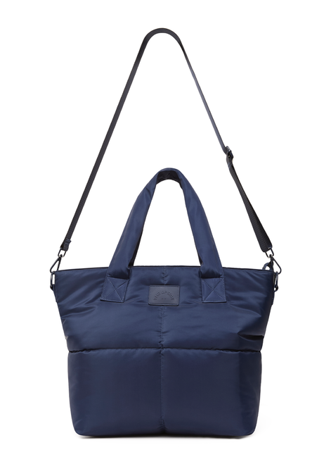 THE UPSIDE navy Barre Tote is fully insulated with multi internal pockets, a zip closure and an adjustable and removable shoulder strap. Made for everyday wear.