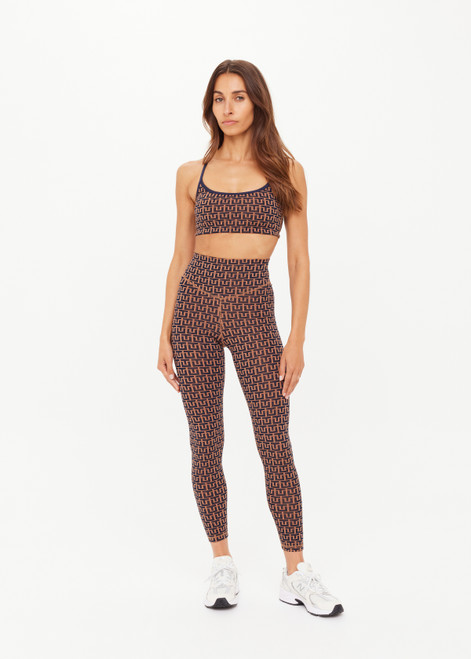 THE UPSIDE women's navy & camel recycled jacquard Castilla 25inch Legging is high-rise with a V panel waistband. Made for yoga & pilates.