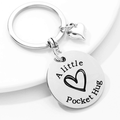 Carry a touch of love and affection with you wherever you go with this endearing and comforting A Little Pocket Hug Keychain!