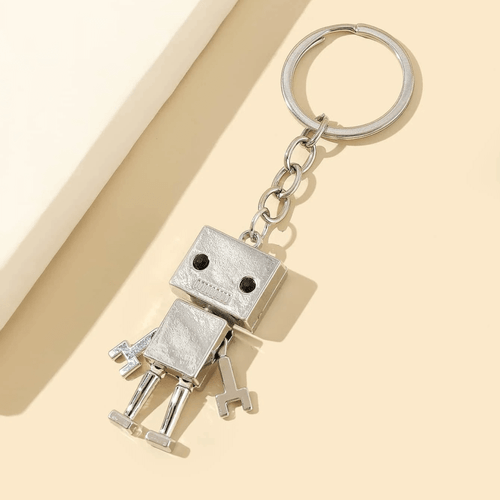 This delightful Robot Charm Keychain features a lovable robot, complete with dangly arms and legs and a sweet little face.