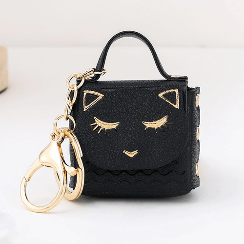 A compact and convenient Mini Bag Cat Keychain designed to hold your little fidgets, coins, and other small essentials, while keeping them safe and easily accessible at all times!
