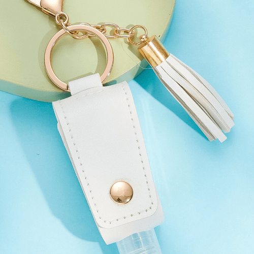 Hand Sanitiser Bottle Keychain - Grey comes equipped with a refillable bottle designed for hand sanitiser, ensuring you always have cleanliness at your fingertips.