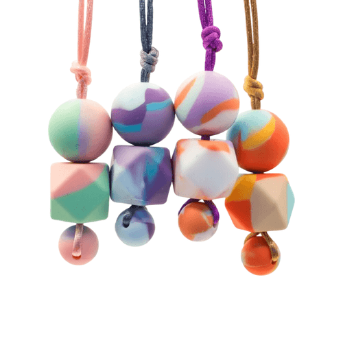 The Tie Dye Adult Chew Necklace seamlessly marries the retro charm of tie-dye with the modern need for sensory relief.