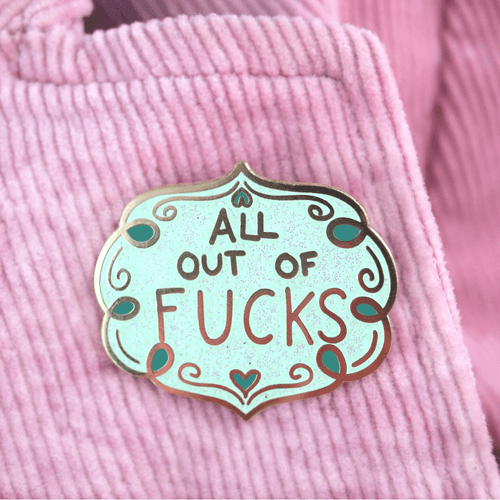 Jubly-Umph - All Out Of Fucks Lapel Pin is the ultimate accessory for those days when you want to wear your heart (or lack of cares) on your sleeve, or rather, your lapel.