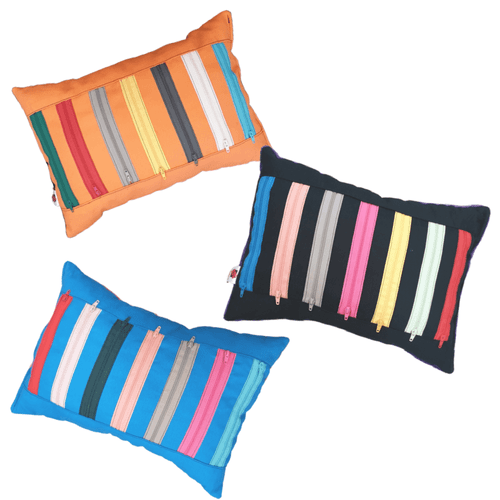 Whether for cuddling during rest or satisfying the need to fidget, the unique, hand made Fidget Zip Pillow is a delightful addition to any sensory toolkit.