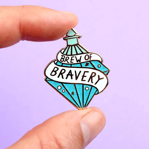 The Jubly-Umph - Brew of Bravery Lapel Pin is more than just an accessory; it symbolises courage and resilience in adversity.