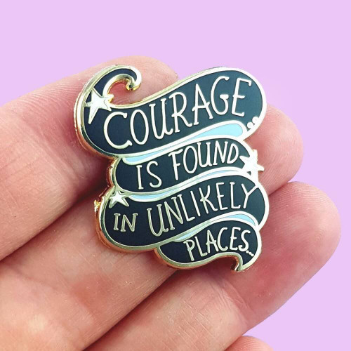Jubly-Umph - Courage Is Found In Unlikely Places Lapel Pin is a celebration of the power of the human spirit and that greatness can come from the most unexpected of places.