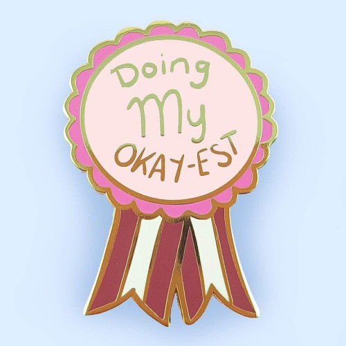 Jubly-Umph - Doing My Okay-est Lapel Pin is a celebration of mediocrity, a wink at the reality that not every day will be a triumph, and that's perfectly fine.