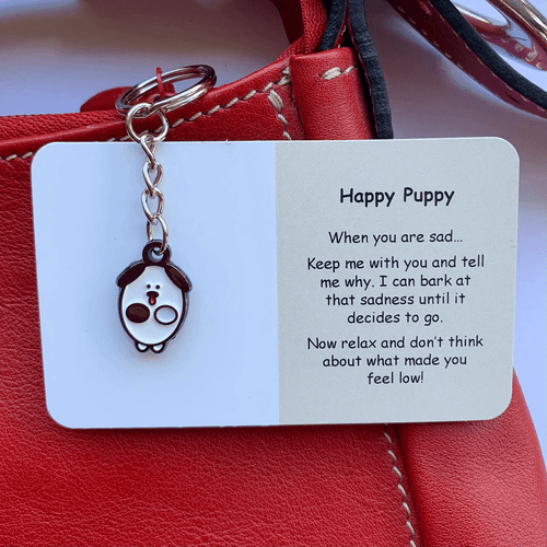 Each Little Joys Keyring - Happy Puppy has been created by Amelie, a teenage artist from New Zealand who is hoping to make a positive difference to people with mental health challenges.