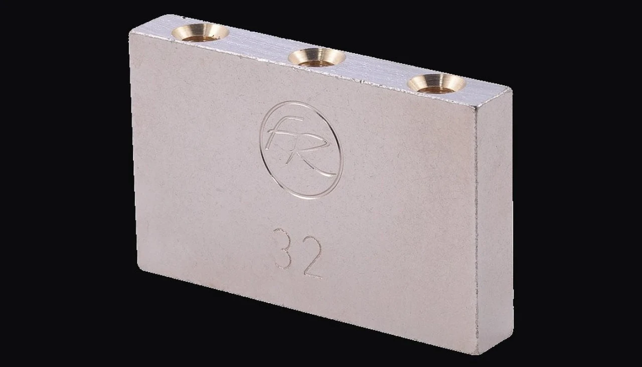 Floyd Rose 32mm sustain block with the size stamped on the face