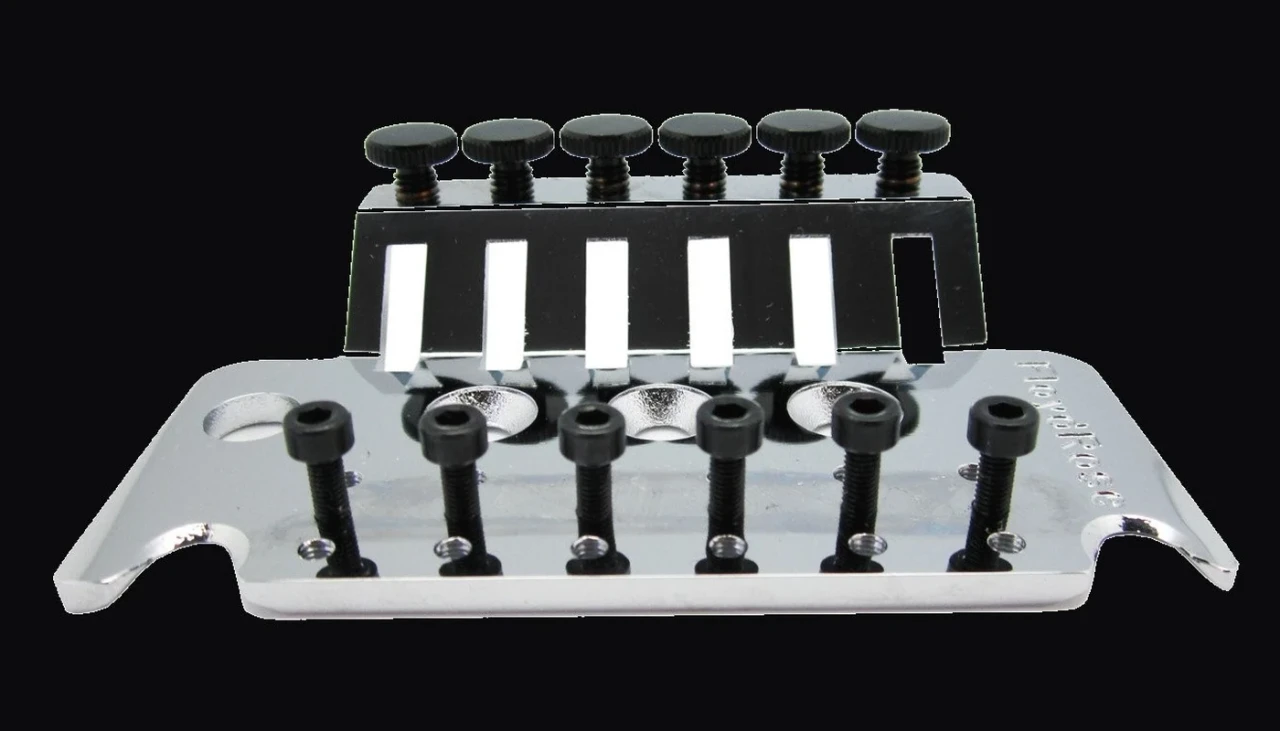 Floyd Rose base plate showing the row of six string saddles