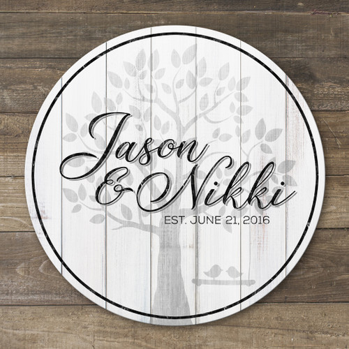 Custom printed round wood family name sign featuring a personalized surname and wedding date, perfect for wedding, anniversary, or housewarming gifts.