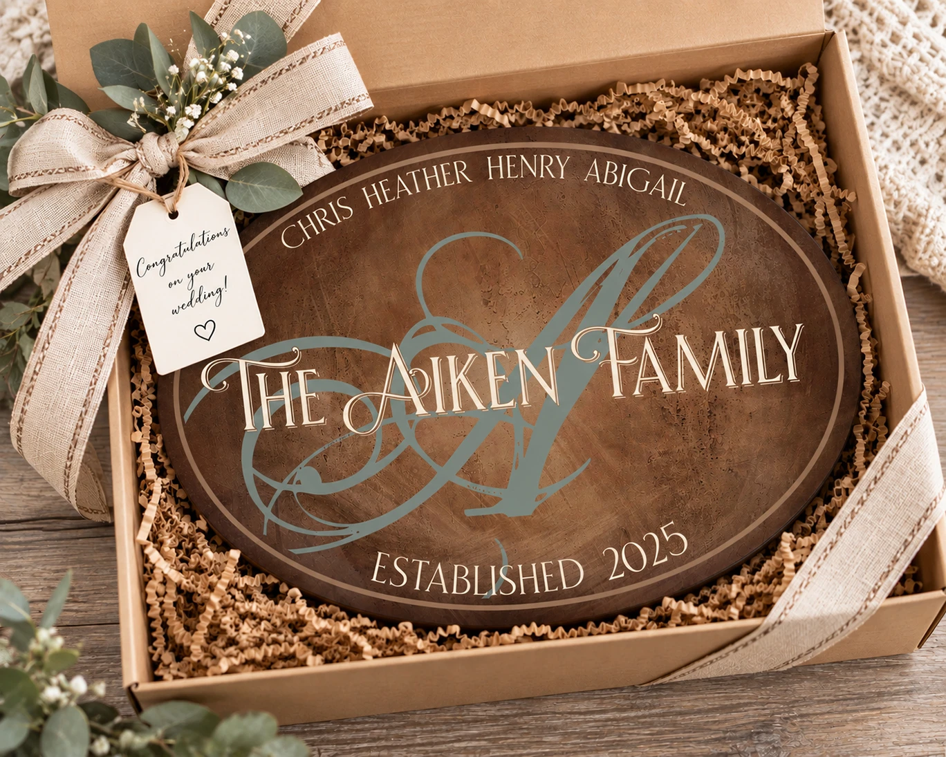 Personalized family name sign packaged in a gift box as a unique wedding gift for newlyweds