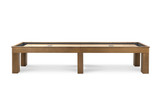 Front-facing studio image of the Paula Parsons shuffleboard table by Doc & Holliday in glazed maple, showing the long Parsons-style apron, solid maple legs, and full Canadian maple butcher block playfield