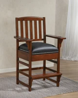American Heritage Billiards King Chair, wooden frame with suede upholstery and nailhead trim, in a living room setting.