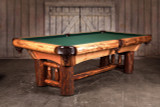 Doc & Holliday Woodslee Slate Pool Table, rustic wooden pool table with green felt surface and sturdy log legs in a rustic barn setting.