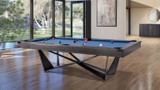 Plank & Hide Co Essex Steel Slate Pool Table in a modern living room with large windows and wooden flooring.