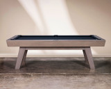 Doc & Holliday George Pool Table & Shuffleboard Combo in Glazed Pearl, showcasing a sleek, modern design with a wooden finish, positioned against a neutral wall on a polished concrete floor.