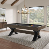 Nichols contemporary industrial pool table by Plank & Hide featuring bold steel X-shaped legs and rustic wood rails, styled in a modern living room with large windows and natural light.