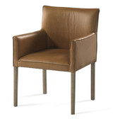 Plank & Hide Co Benjamin Game Chair Washed Oak, a stylish armchair with a washed oak wooden frame and tan leather upholstery.