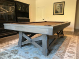 Sawyer Twain Powell 8' Pool Table with Premium Accessories, stylish and sturdy indoor game table in a game room with elegant decor and area rug.