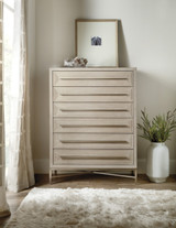 Hooker Furniture Chester Tufted Stationary Sofa, minimalist modern bedroom dresser with a textured wood finish and a decorative plant in a white vase.
