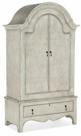 Hooker Furniture Kandor Leather Stationary Sofa, elegant and vintage-style wooden wardrobe with a distressed white finish, arched top, two doors, and a bottom drawer, with antique metal handles.